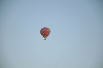 Low angle view of hot air balloon against clear sky