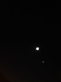 Low angle view of moon against sky at night