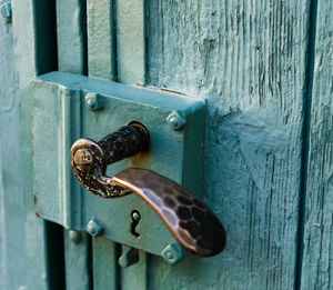 Close-up of padlock on metal door