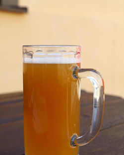 Close-up of beer glass on table