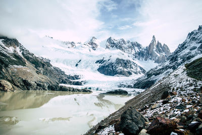 Glacial lake with snowcapped mountain in the background