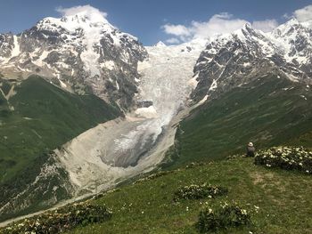 Scenic view of snowcapped mountains against sky