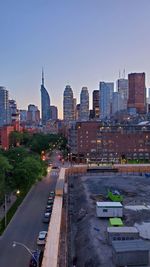 View of city buildings against clear sky