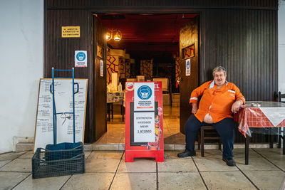 Portrait of man sitting in store