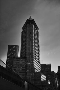 Low angle view of buildings against sky at dusk