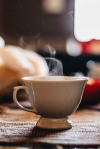 Close-up of coffee cup on table