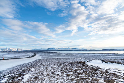 Scenic view of sea against sky during winter