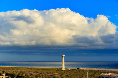 Scenic view of sea against cloudy sky