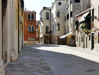 Narrow street amidst buildings in town