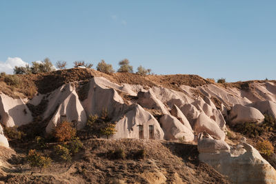 Rock formations in desert against clear sky