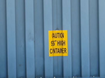 Close-up of warning sign on wall