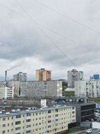 High angle view of buildings in city against sky