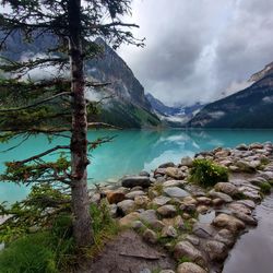 Scenic view of lake and mountains against sky