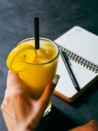 Midsection of person holding drink