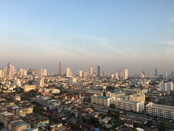 High angle view of modern buildings in city against sky