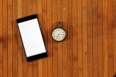 High angle view of clock on table