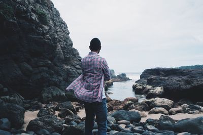 Man standing on rock formation