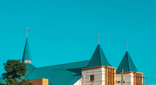 Low angle view of church against clear blue sky