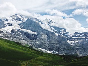 Scenic view of snowcapped mountains against sky