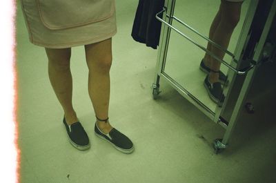 Low section of woman standing on floor