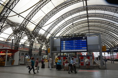People walking on railroad station platform