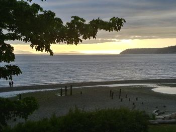 Scenic view of sea against sky at sunset