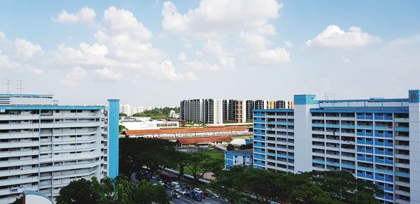 High angle view of modern buildings against sky