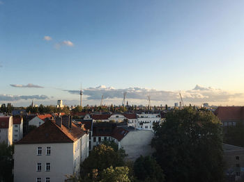 High angle view of buildings in town against sky