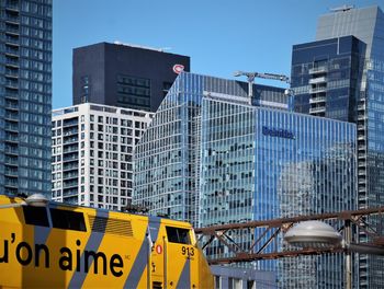 Low angle view of modern buildings against sky in city