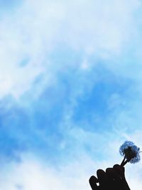 Low angle view of statue against blue sky