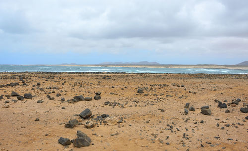 Scenic view of beach against sky