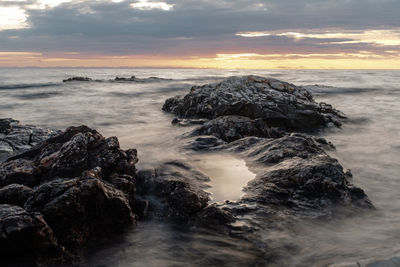 Scenic view of sea against sky during sunset long exposure