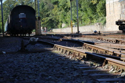 Railroad tracks by trees against sky