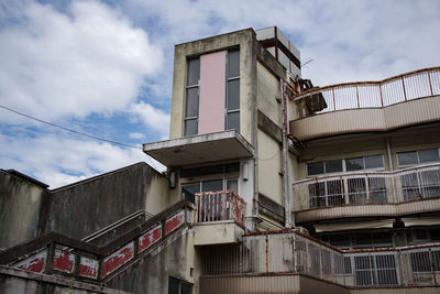 The decaying building and blue sky of motoazabu, tokyo