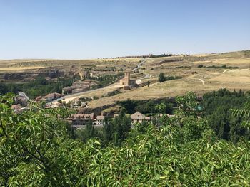 Scenic view of agricultural field against clear sky