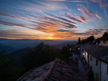 High angle view of buildings against sky during sunset