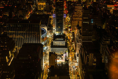 Illuminated buildings in city at night