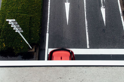 High angle view of red car on road seen from bridge