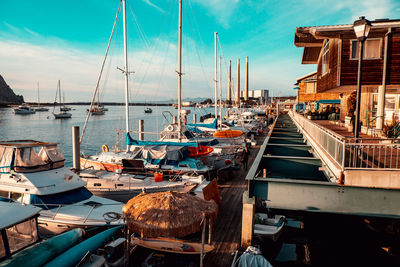 Boats moored at harbor