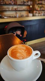 Close-up of coffee cup on table