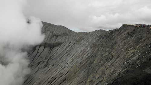 Scenic view of volcanic mountain against sky