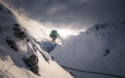 Man skiing on snowcapped mountain