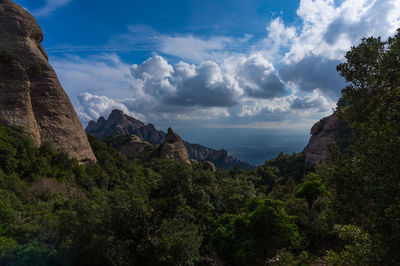 Scenic view of mountains against cloudy sky