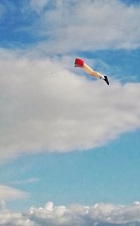 Low angle view of airplane flying in sky