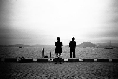 Rear view of woman looking at sea