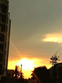 Low angle view of silhouette buildings against sky during sunset