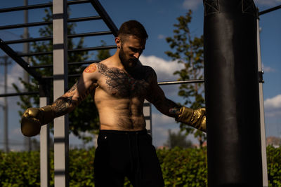 Young man exercising in gym