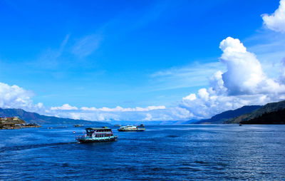 Scenic view of sea against blue sky