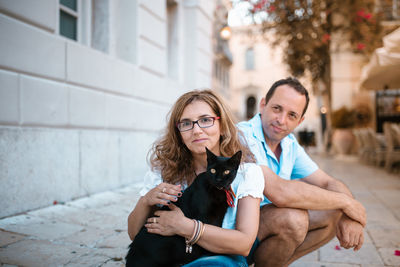 Portrait of friends sitting outdoors