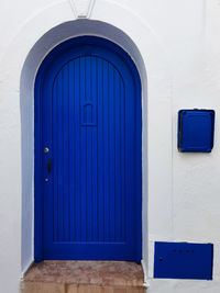 Wooden blue door in the old medina of asilah